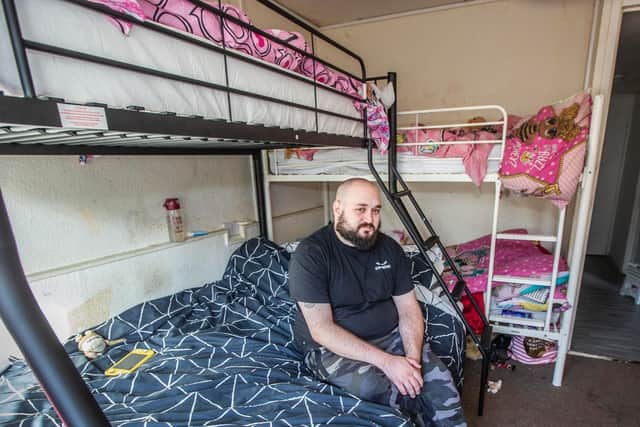 Dad Paul Simpson shares his bedroom with his partner and four children. Pictures by Kirsty Edmonds.