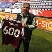 Nicky Adams was presented with a commemorative shirt at Wigan after making his 600th career appearance.