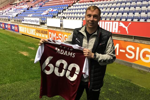 Nicky Adams was presented with a commemorative shirt at Wigan after making his 600th career appearance.