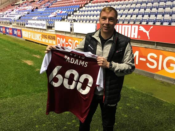 Nicky Adams was presented with a commemorative shirt at Wigan after making his 600th career appearance.