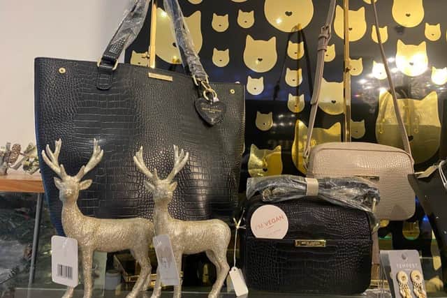 Handbags and more are on sale in the shop.