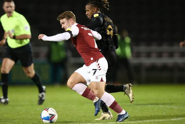 Sam Hoskins holds off David Kasumu. Picture: Pete Norton