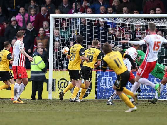 Ricky Holmes' stoppage-time winner at Stevenage effectively secured the title in 2016.