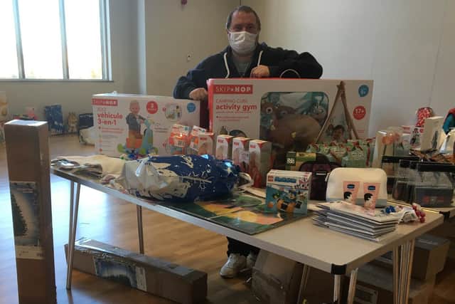 Peak Empower chairman Wayne Tuckfield with a selection of the items handed out by the charity to families ahead of Christmas