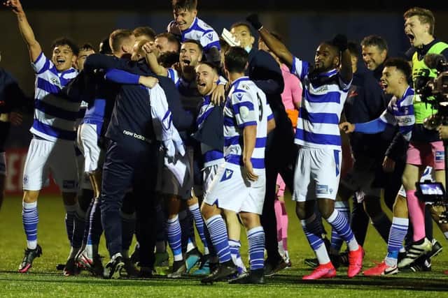 Oxford City's jubilant players celebrate their FA Cup first round win over the Cobblers