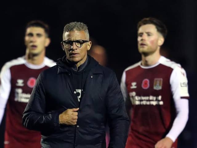 Keith Curle, Luka Racic and Fraser Horsfall disconsolately trudge off the pitch after losing to Oxford on Monday.