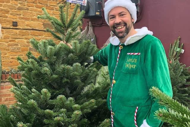 The Tree Buddy founder Andy Cohen dresses up as an elf when he delivers the trees