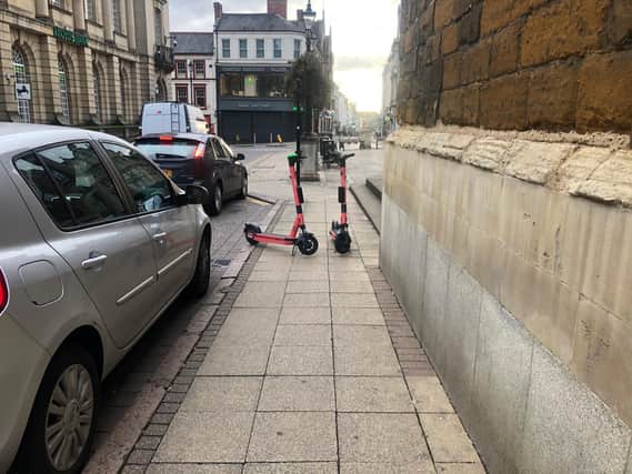 The scooters (pictured at All Saints Church) are often left in the middle of pavements, blocking the footpaths for disabled people and parents' with buggies.