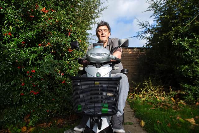Tony Cannon says the overgrown hedge next to his bungalow is causing him issues with getting in and out of his home. Photo: Kirsty Edmonds.