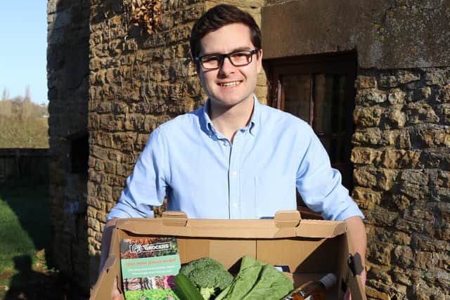 Founder of the company, David Bletsoe-Brown, with a box of fresh produce.