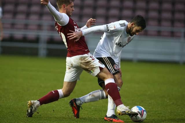 Danny Rose battles for possession in the Cobblers' clash with Accrington
