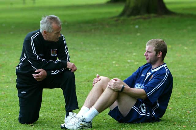 Denis Casey pictured with former Cobblers striker Martin Smith