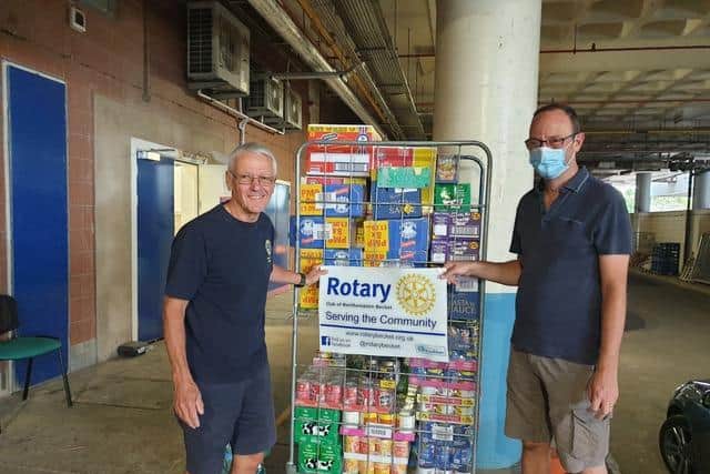 Paul Simpson (left) pictured handing food over to Weston Favell Food Bank worker Paul Foster in the first lockdown, after he helped to raise 6,000 for supplies.