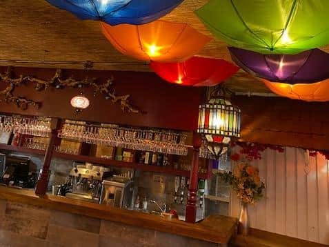 Brightly-coloured umbrellas cover the lights on Alacati Grill's ceiling