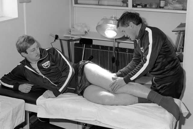 Denis Casey treats Graham Reed in his 'luxury' physio room at the Cobblers' old club house in Abington Avenue