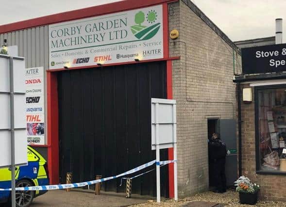 Police are still on the scene after the owner found the man's body at 7.30am today