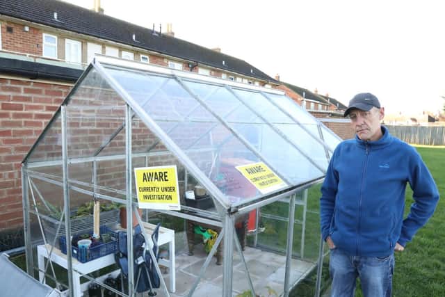 Kettering Council officers have slapped two 'under investigation' stickers on the greenhouse.