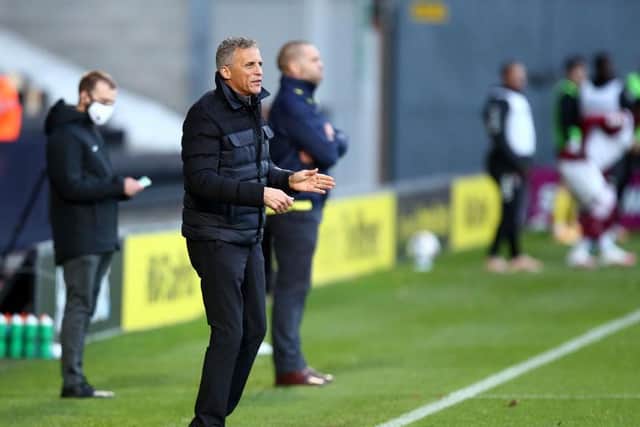 Keith Curle marshals his troops from the touchline at the Pirelli Stadium.