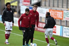 Cobblers players warm up ahead of Saturday's game against Burton.