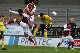 Harry Smith and Caleb Chukwuemeka challenge for the ball at Burton. Picture: Pete Norton