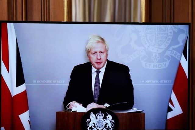 Boris Johnson delivered last night's press conference via video link while he is self-isolating. Photo: Getty Images