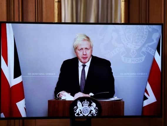 Boris Johnson delivered last night's press conference via video link while he is self-isolating. Photo: Getty Images