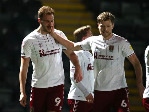 Fraser Horsfall congratulates Harry Smith on his goal that put the Cobblers 1-0 up against Rochdale (Pictures: Pete Norton)