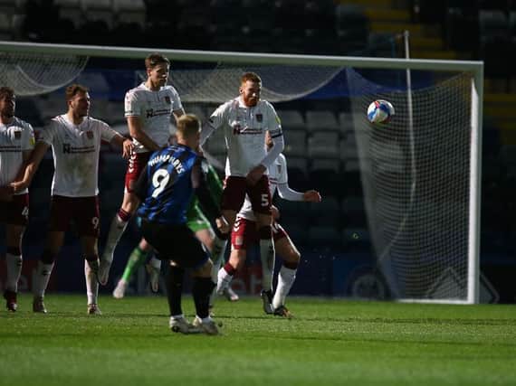 Stephen Humphrys fires homes Rochdale's late equaliser against the Cobblers (Pictures: Pete Norton)