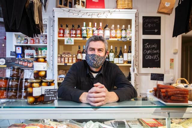 Owner, Steve Ward, stands proudly over the deli counter as he hopes for a busy Christmas at his shop.
