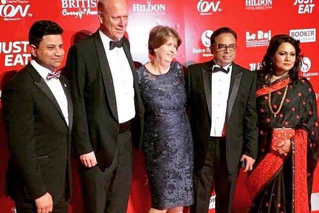 Naz Islam (left) and Enam Ali (one from right) pictured with Chris Grayling at the British Curry Award