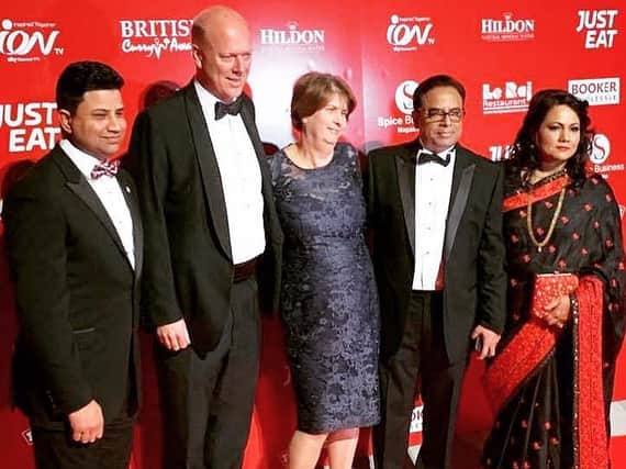 Naz Islam (left) and Enam Ali (one from right) pictured with Chris Grayling at the British Curry Award