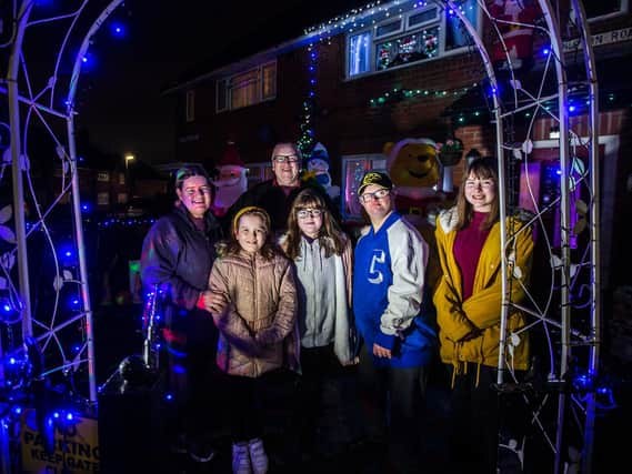 Dad Chris and mum Ann with their children, Kieran, 26, Grace, 13, and twin sisters Katie-Ann Sinead-Erin, 9, outside their home in Whiston Road. Picture by Kirsty Edmonds.