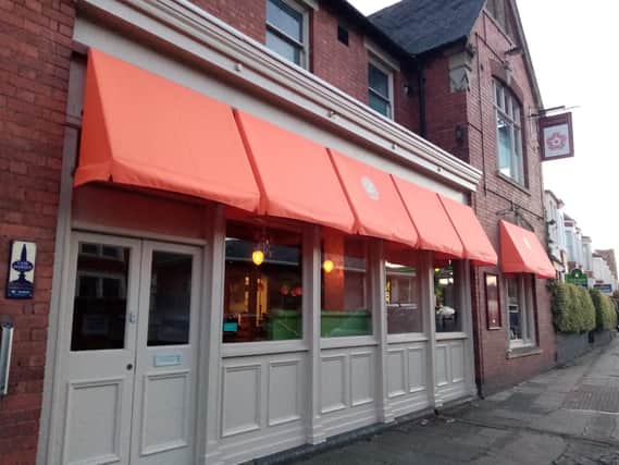 The County Tavern Pub redecorated with some orange awnings - so some readers thought it had been taken over.