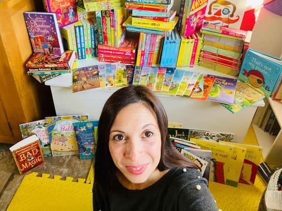Kate has more than 170 books to deliver to organisations who will hand them out to children this Christmas.