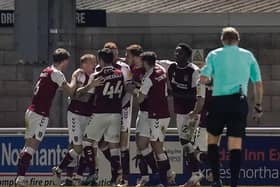 The Cobblers players celebrate Cian Bolger's match-winning goal against Fleetwood on Tuesday night