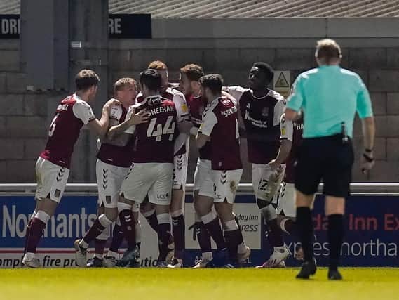 The Cobblers players celebrate Cian Bolger's match-winning goal against Fleetwood on Tuesday night