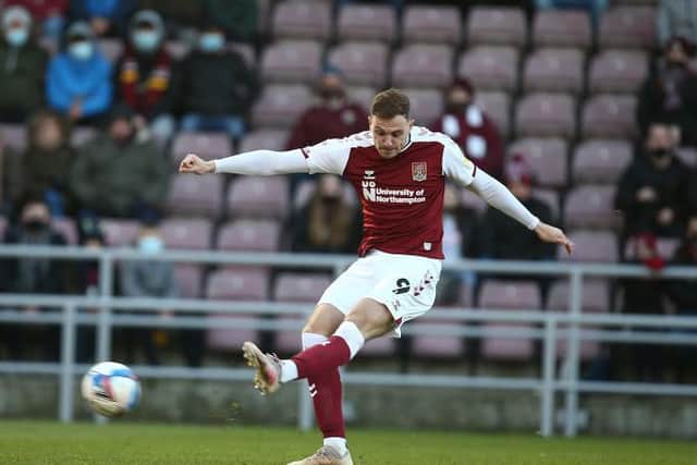 Harry Smith gets a shot away during the Cobblers' defeat to Doncaster