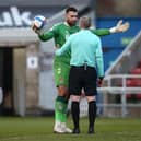 Referee Graham Salisbury played the role of pantomime villain as Cobblers fans returned on Saturday.
