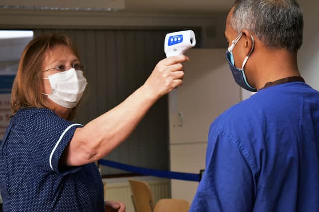 Consultant maxillofacial surgeon Philip Ameerally was the first person at Northampton General Hospital to receive the coronavirus vaccine. Photo: NGH