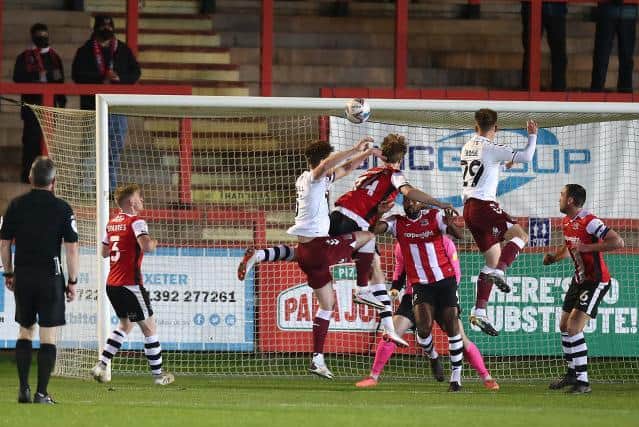 Danny Rose leaps high to head in the opening goal at St James Park.