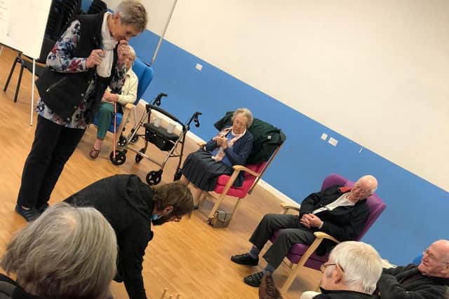Residents pictured together playing games and making friends.
