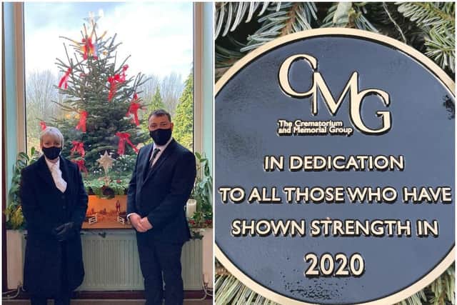 Janene Hart and Tom Shellard from Counties Crematorium with the memorial Christmas tree and the plaque to all those that have shown strength in
2020