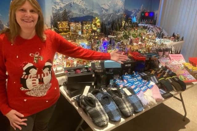 Sue Adkins with the model village and some of the gifts for the hospital.