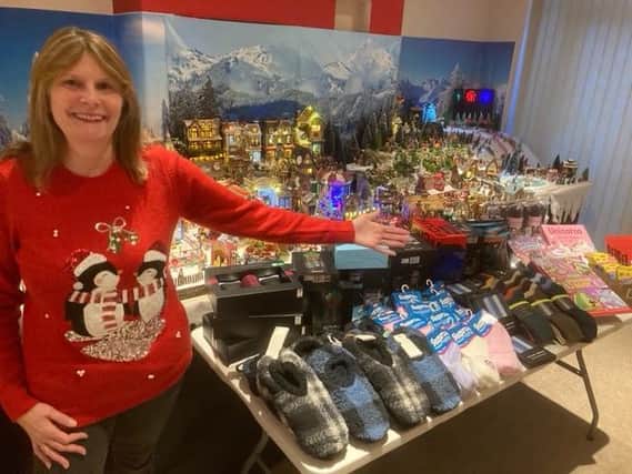 Sue Adkins with the model village and some of the gifts for the hospital.