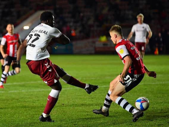 Benny Ashley-Seal drills home the Cobblers' winning goal at Exeter City (Pictures: Pete Norton)