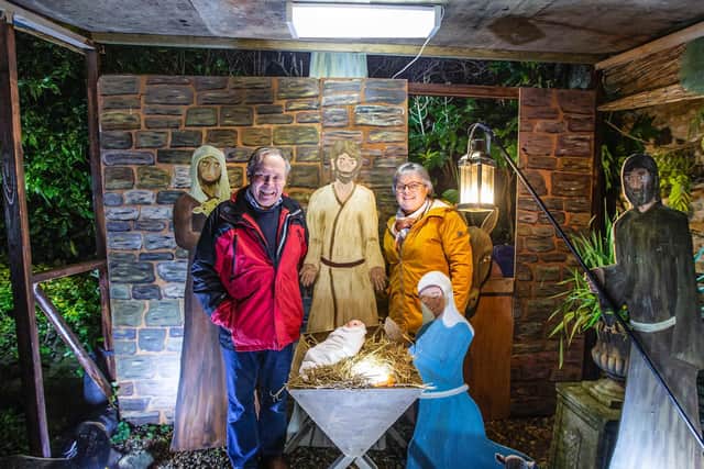 Richard and Cathy Askew with his 'labour of love' life size nativity scene. Photo: Kirsty Edmonds.