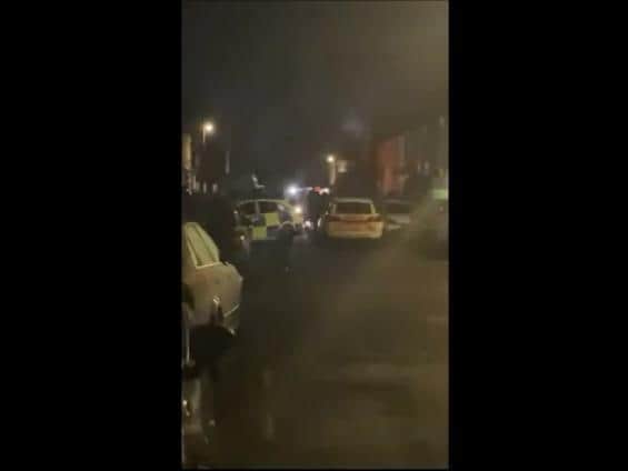 Police cars block Forfar Street in Northampton after breaking up an illegal party attended by dozens of people. Photo: UGC