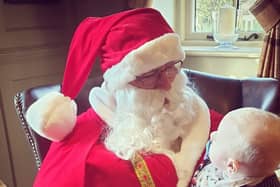 Santa, who will be visiting streets across Duston on Sunday (December 20), with his grandson.