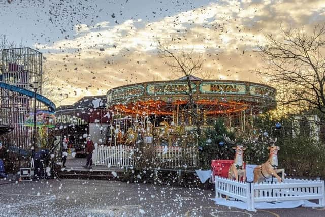 Fake snow made the Christmas party at Nicholas Hawksmoor Primary School in Towcester even more special, along with the carousel, reindeer and helter-skelter. Photo: Suzanne Kentish