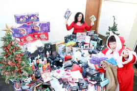 Jeanette - Mother Christmas - and helper Jessie with some of the gifts bought with the money raised by the online appeal